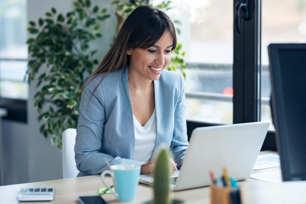 Professional working on laptop in office