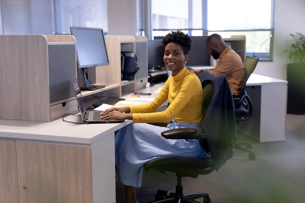 Professional woman working in cubicle