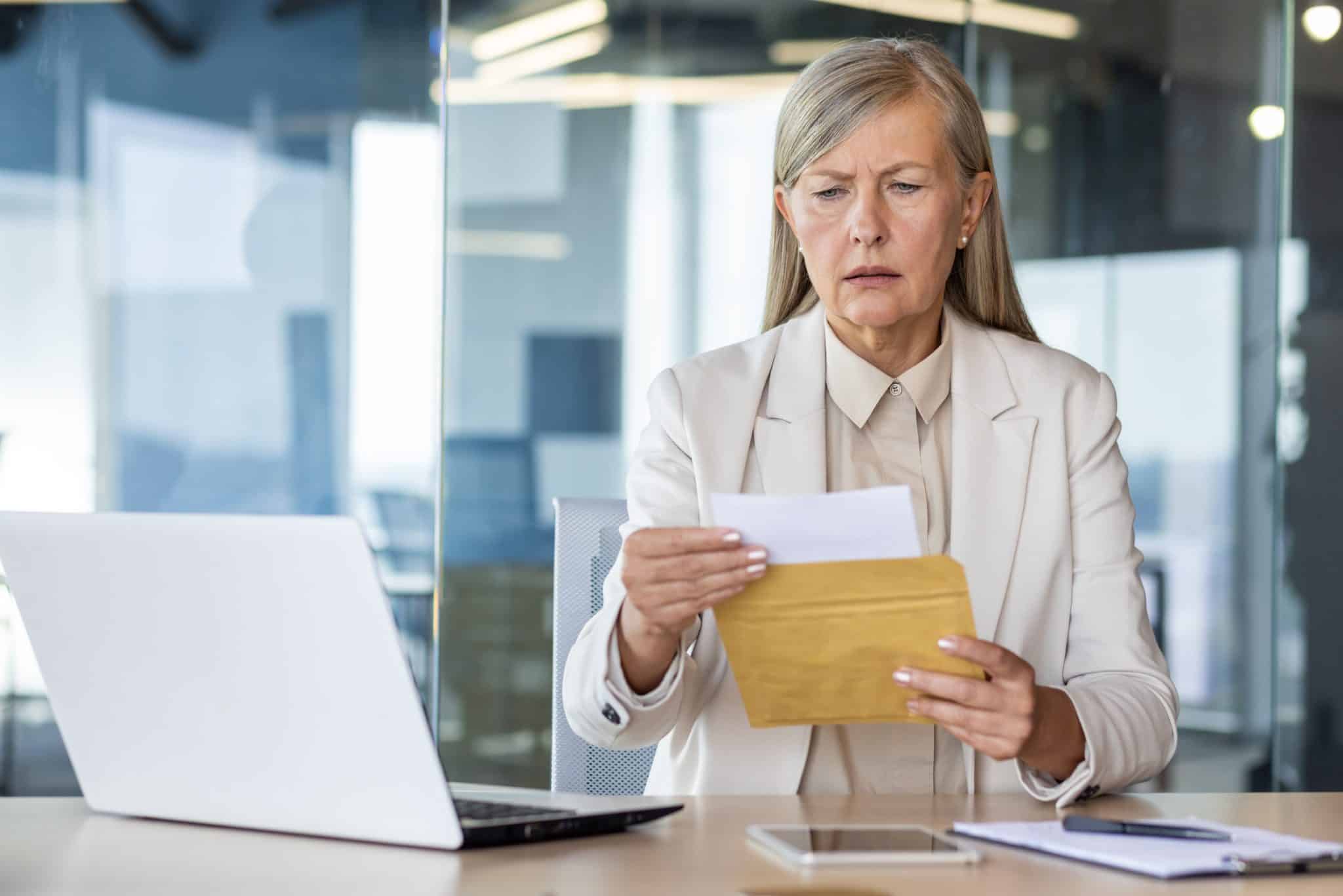 worried woman opening cease and desist letter